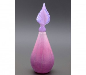 Pink glass vase with twisted leaf stopper
