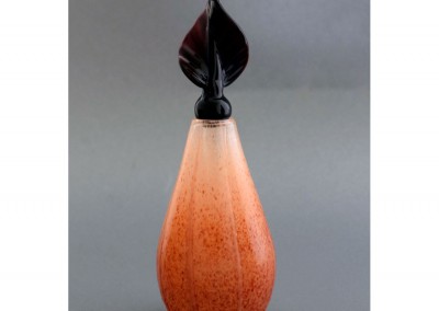 Orange/red glass vase with twisted leaf stopper